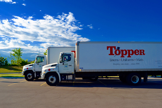 Topper Linen and Uniform Company Delivery Trucks